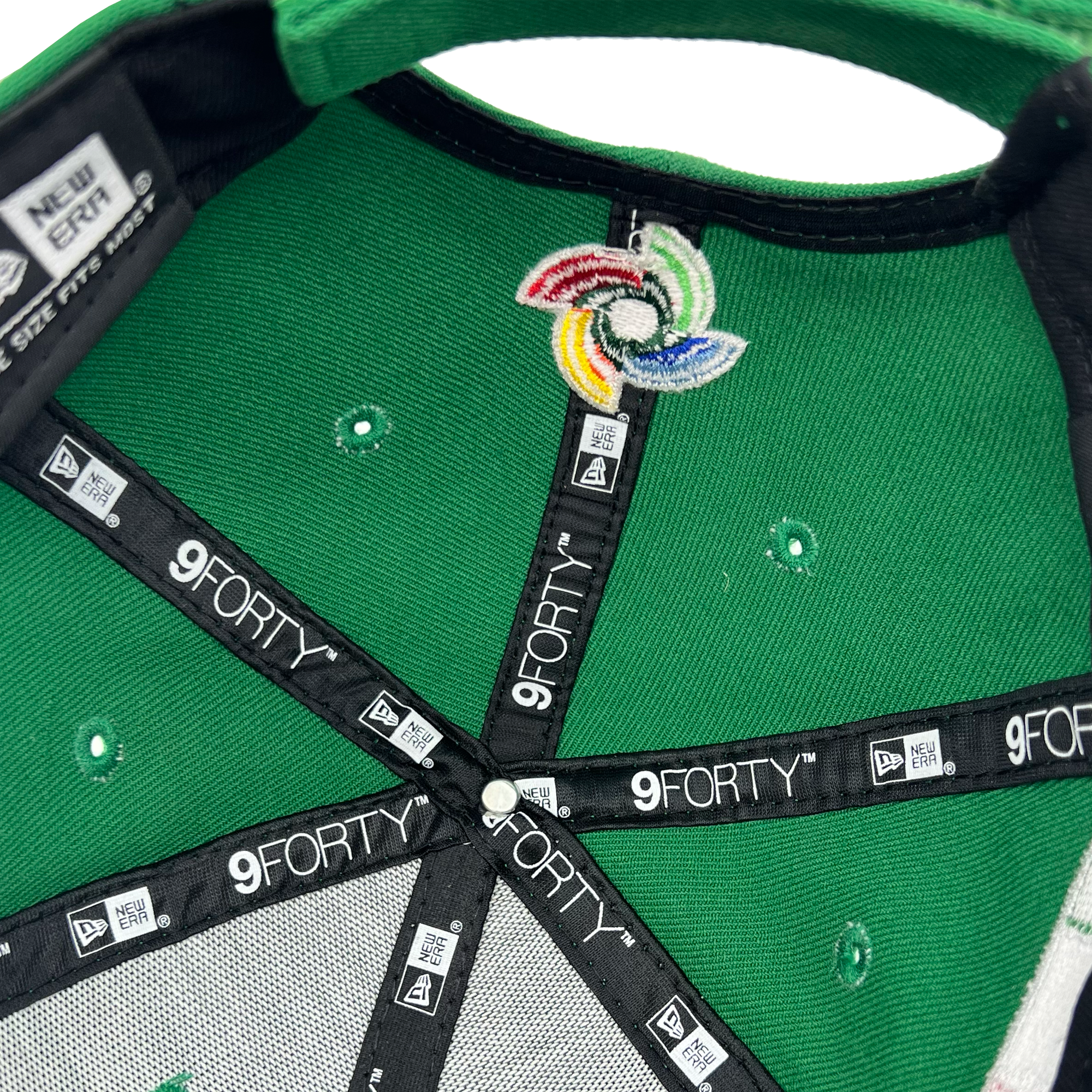 Image inside crown of a green cap with black taping with black 9FORTY taping and New Era wordmarks on repeat.