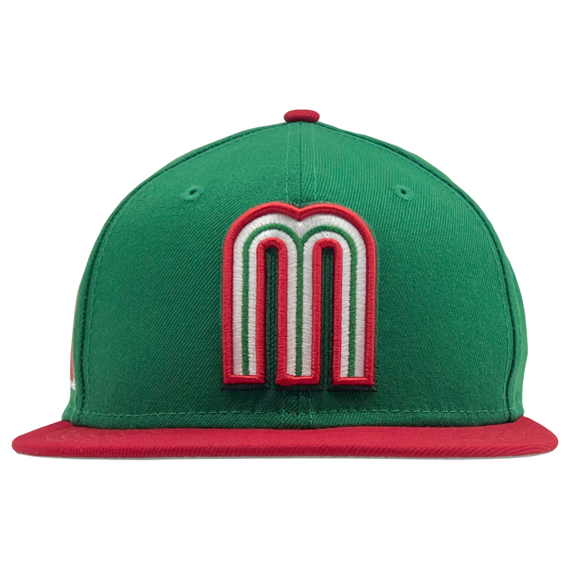 Front view of green New Era fitted cap with red and white Mexican baseball M patch and red bill.
