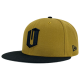 New Era 59FIFTY gold fitted cap with black embroidered O for Oakland & black bill. It is angled to show the New Era logo on the left wear side.