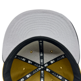 Inside crown view of New Era 9FIFTY fitted cap with black New Era taping and grey under visor.