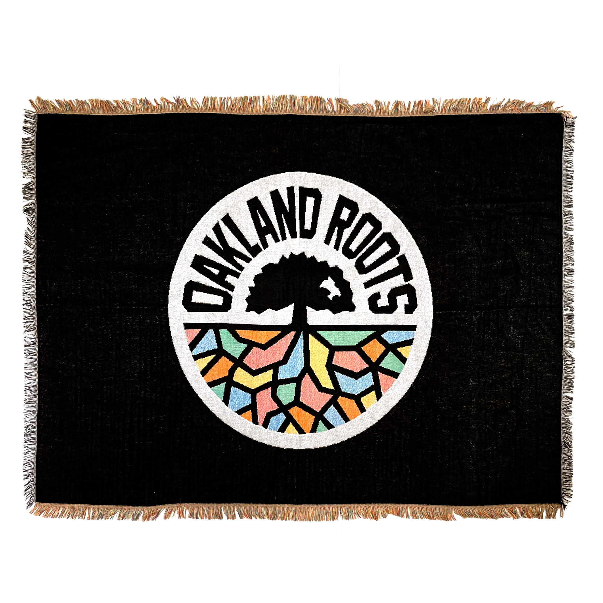 Black blanket with colored fringe and large full-color Oakland Roots SC circle logo in the center.