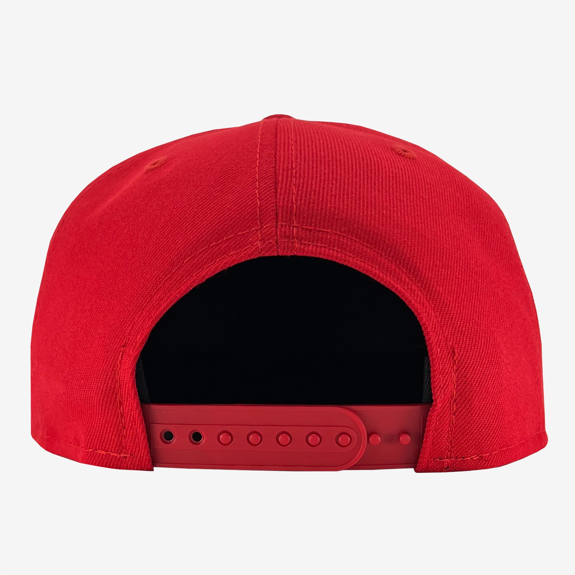 Rear view of a red New Era Official 9FIFTY Snapback baseball cap with an adjustable snapback closure. The hat, crafted by Oaklandish, features a fabric crown and a plastic strap with multiple holes for size adjustment. The stitching is visible along the seams. The background is plain white.