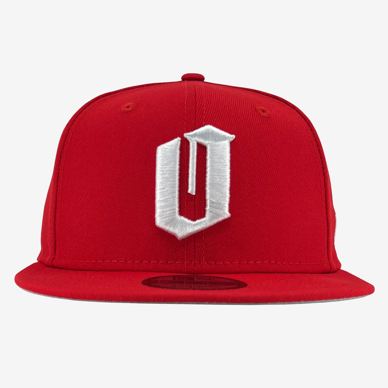 New Era 9FIFTY red cap with white embroidered O for Oakland and New Era sticker on bill.