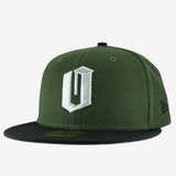 Green New Era cap with an embroidered white O logo and black bill. 