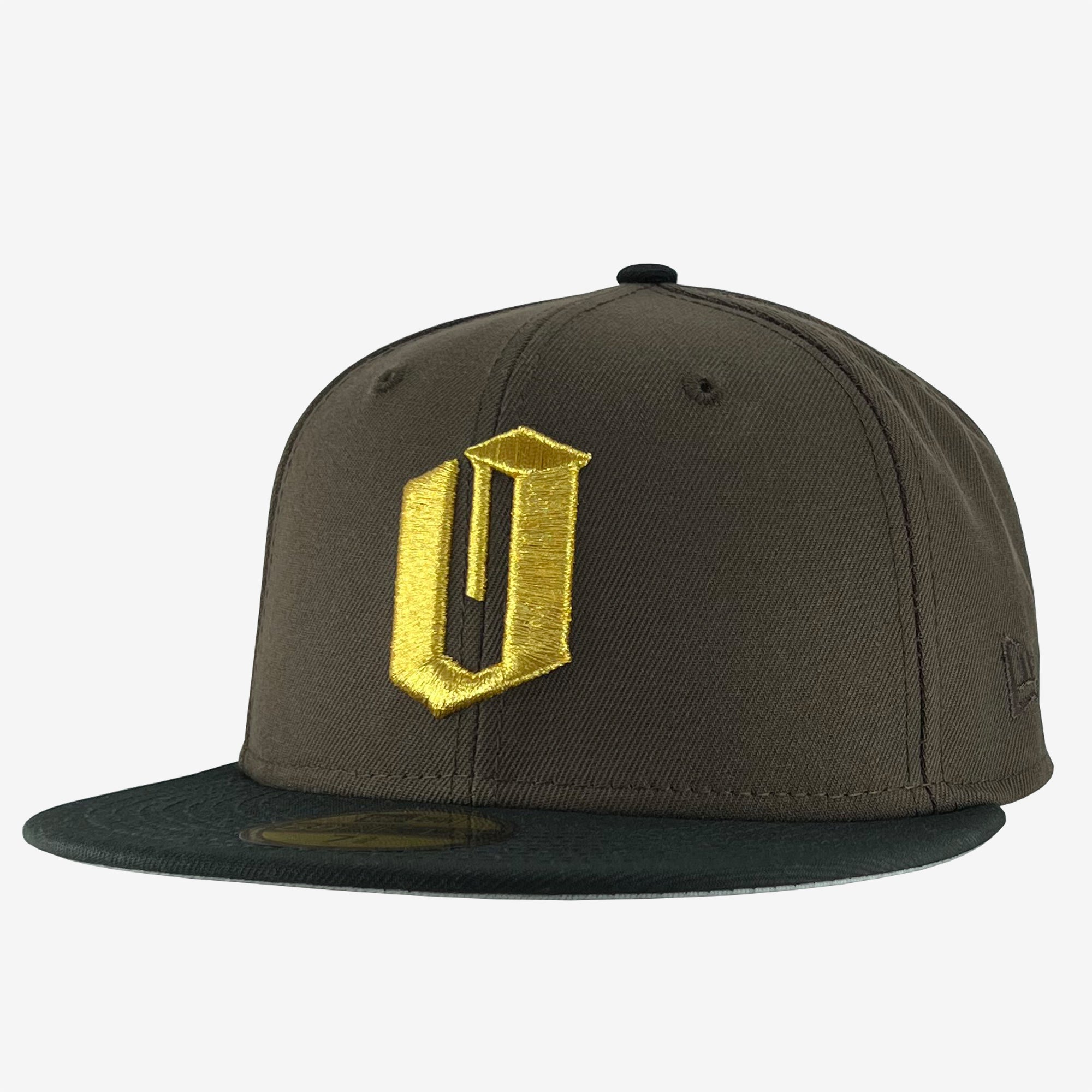 New Era 9FIFTY walnut brown cap with gold embroidered O for Oakland & black bill. Tilted to show New Era logo on left wear side.
