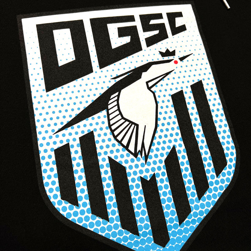 Detailed close-up of Oakland Genesis soccer league heron logo on a black hoodie.
