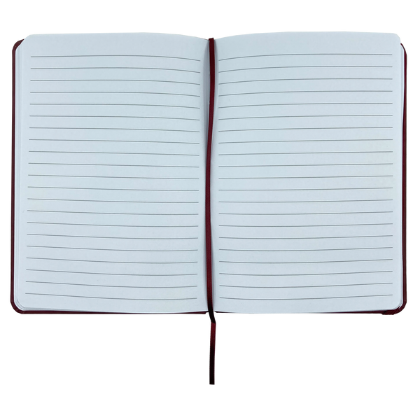 Top view of journal notebook open to show blank lined pages.