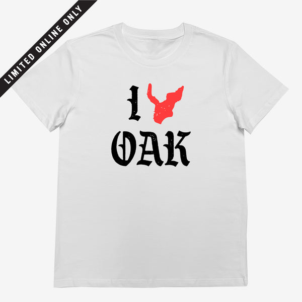 White women's t-shirt with ”I Oak” in black font and a red map of Oakland replacing the heart between I and Oak.