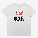 White women's t-shirt with ”I Oak” in black font and a red map of Oakland replacing the heart between I and Oak.
