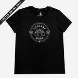 Women’s black t-shirt with white hand-drawn Oakland Made wordmark and chesnuts in a circular graphic on chest.