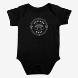 Black infant one-piece with a white circle graphic with the words “Oakland Made” and hand-drawn chestnuts. 