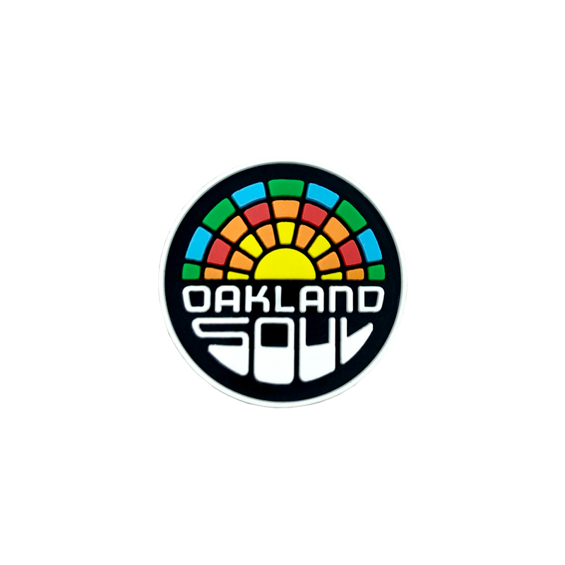 Plastic shoe charm of full-color Oakland Soul logo.