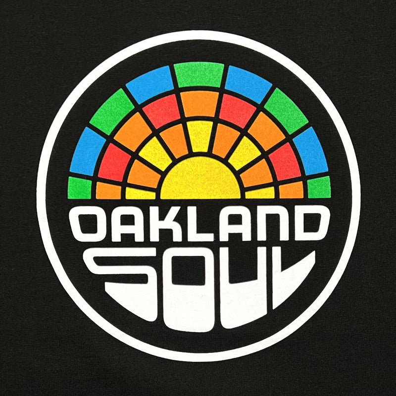 Close up of a full color Oakland Soul logo on black t-shirt.