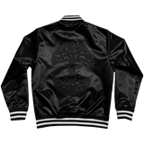  The backside of Mitchell & Ness black satin reversible jacket with a large centered Oaklandish tree logo with black and white ribbing at the collar, cuff, and waistband.