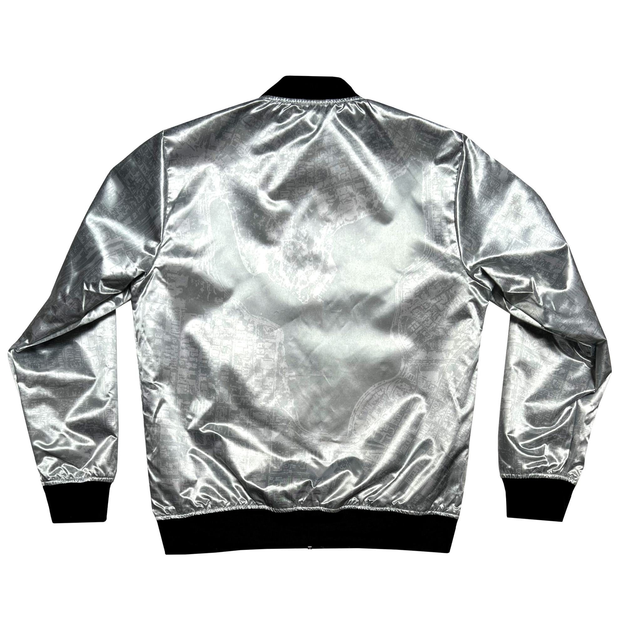 The back view of the Mitchell & Ness x Oaklandish Reversible Satin Jacket showcases a shiny silver bomber style with long sleeves, diamond pattern, and ribbed black collar, cuffs, and waistband. Its reflective surface lends a modern touch against the white backdrop.