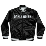 Mitchell & Ness black satin reversible jacket with Oaklandish wordmark across front chest with black and white ribbing at collar, cuff, and waistband.