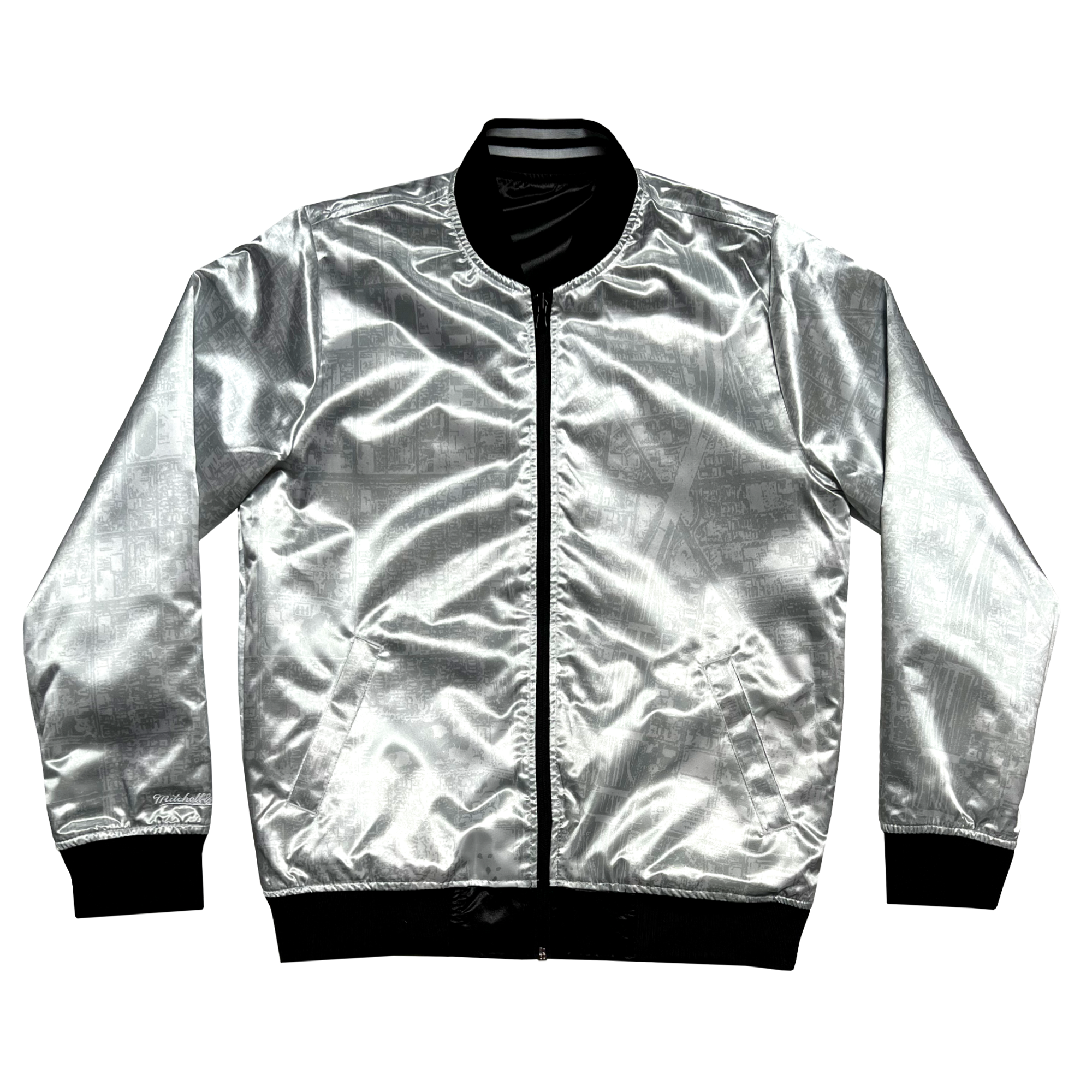 Front view of the silver reverse side of a satin jacket, imprinted with an aerial map of Oakland.