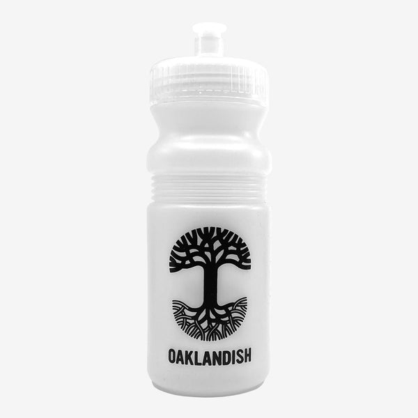Frost white bicycle water bottle with a black Oaklandish tree logo and wordmark .