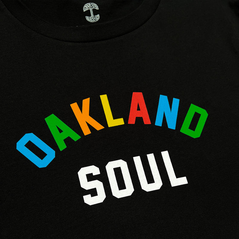 Close up of full color Oakland Soul wordmark logo on women’s black t-shirt.
