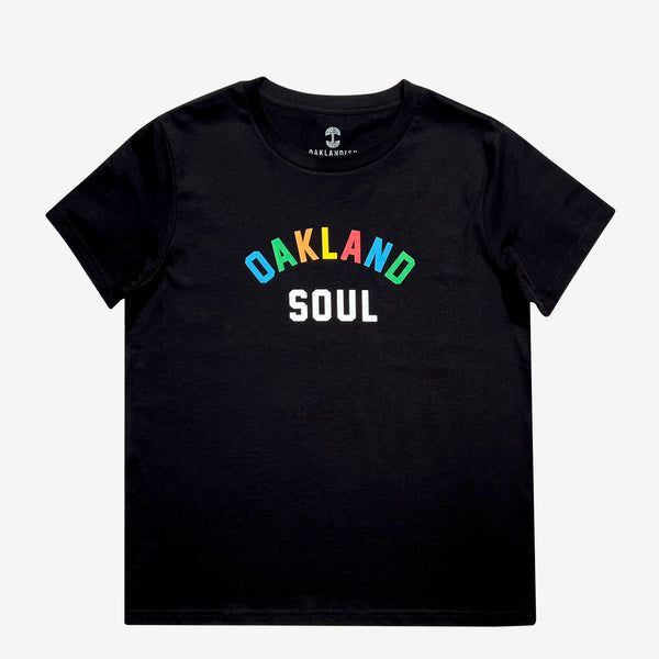 Full color Oakland Soul wordmark logo on a woman’s black t-shirt.
