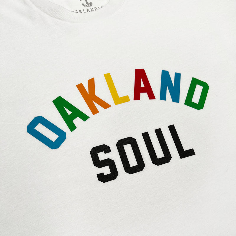 Close up of full color Oakland Soul wordmark logo on women’s white t-shirt.