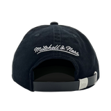Back view of a black snapback dad cap with white embroidered Mitchell & Ness wordmark. 