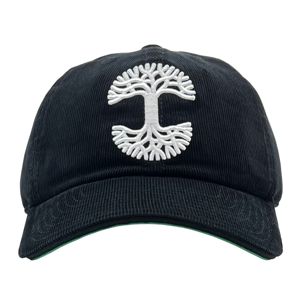 Front view of black Mitchell & Ness snapback truckers cap with white embroidered Oaklandish tree logo.