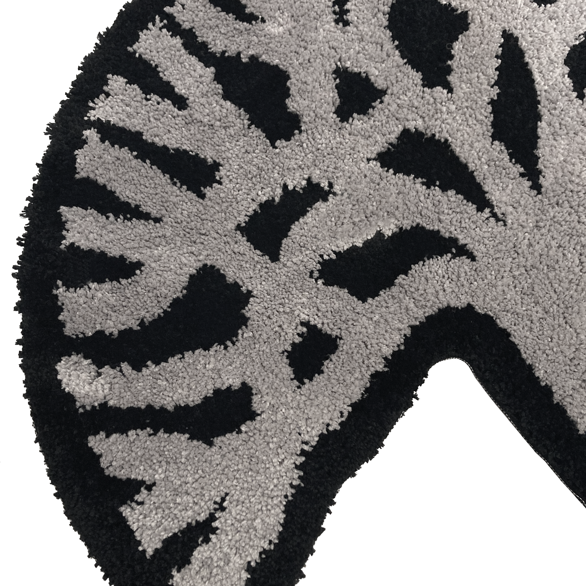 Detailed close-up of section of the Oaklandish tree logo on black and light grey area rug.