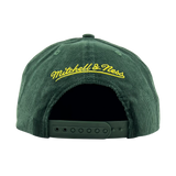 Back view of a green corduroy snapback cap with yellow embroidered  Mitchell & Ness wordmark. 