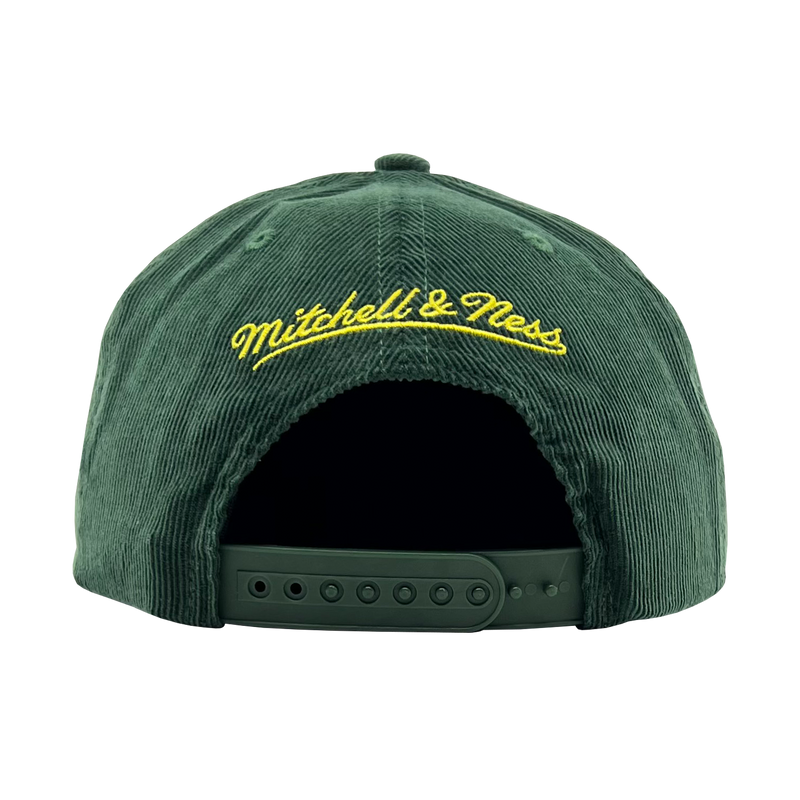 Back view of a green corduroy snapback cap with yellow embroidered  Mitchell & Ness wordmark. 