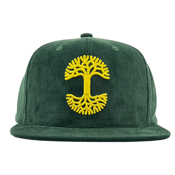 Front view of a green corduroy Mitchell & Ness cap with yellow Oaklandish with embroidered yellow Oaklandish tree logo.