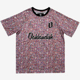 Multi-colored speckled soccer jersey with cursive Oaklandish wordmark and black O for Oakland applique.