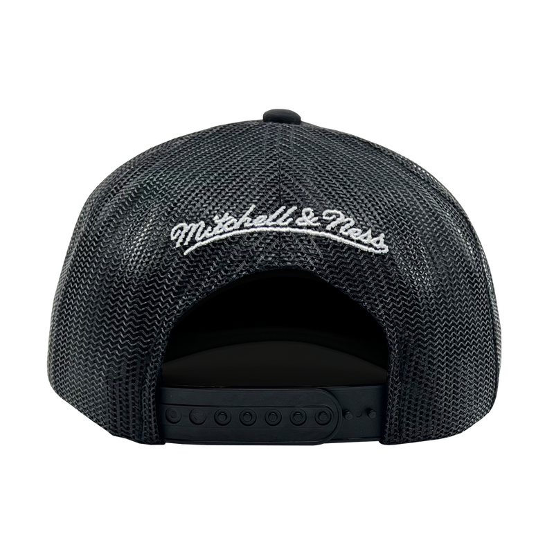 Back view of a black snapback truckers cap with white embroidered Mitchell & Ness wordmark. 