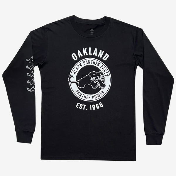 Front view of long sleeve black t-shirt with Black Panther Party Alumni Legacy Network  logo and right sleeve panther print.