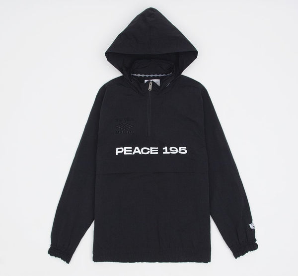 Image of black 1/4 zip nylon pullover hoodie with detachable hood and embroidered umbro on front left chest and screen printed 'Peace 195' above kangaroo pocket and dove on left sleeve.