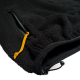Detail close up of adjustable hem shock cord and yellow pocket zipper pull cord on a black Oaklandish polar fleece.