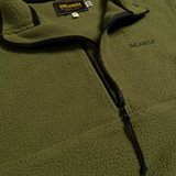 Detail close up of Oaklandish Wordmark in black on green 1/2 zip polar fleece at an angle.