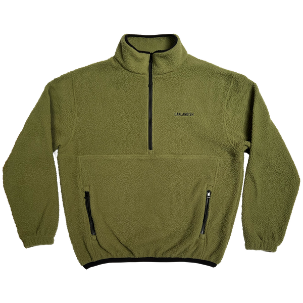 Front view of a green polar pullover fleece with ½ zip pockets and a black Oaklandish wordmark on the left chest wear side.