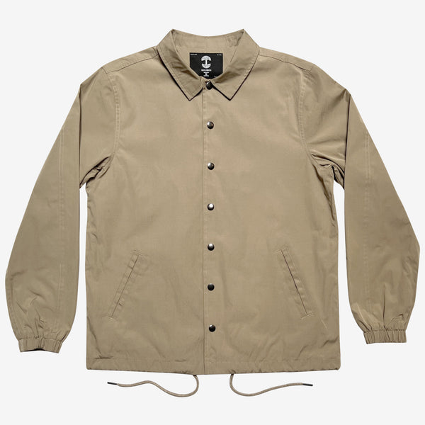 Khaki cotton coaches jacket with snap closures, collar and drawstring waist.