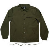 Olive green snap close coaches jacket with 'Oaklandish' wordmark on the wearer's left chest, with a collar and drawstring waist.
