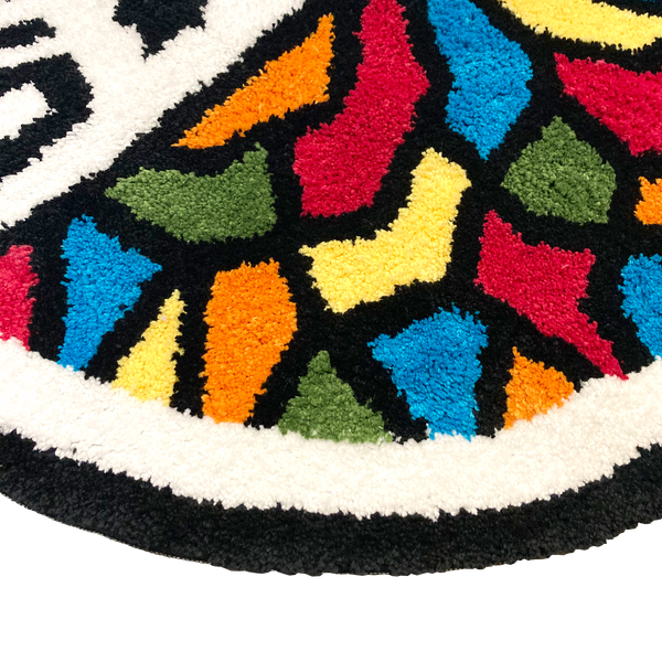 Detailed close up image of round area rug with Oakland Roots SC crest in full color.