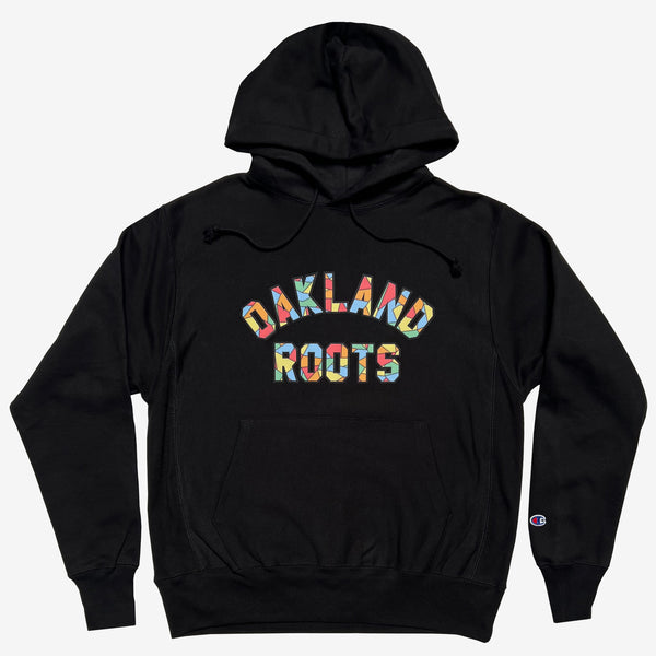 Black pullover hoodie with Oakland Roots Mosaic pattern within applique wordmark 'Oakland Roots'.