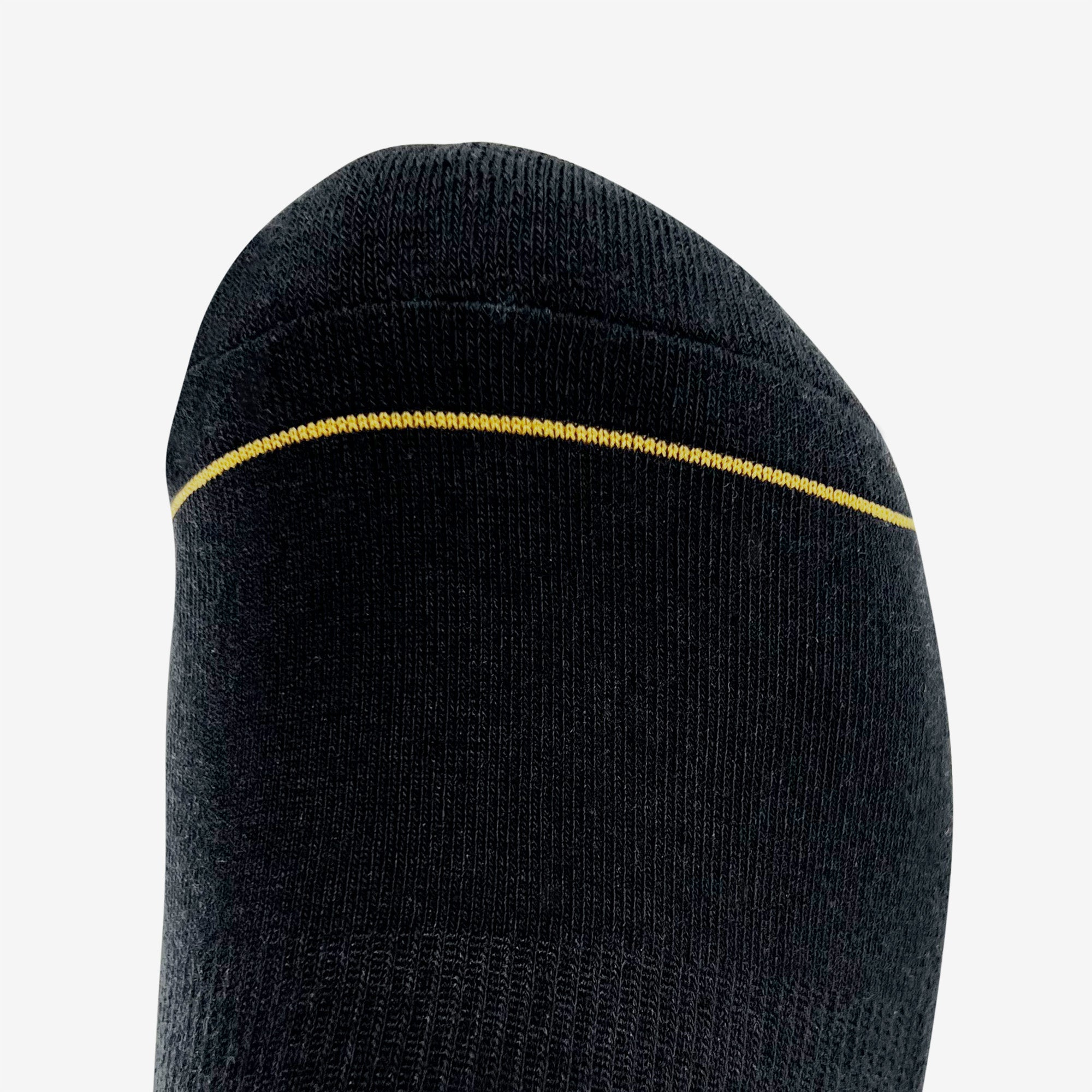 Close up of gold stripe on the toe of a black crew sock.
