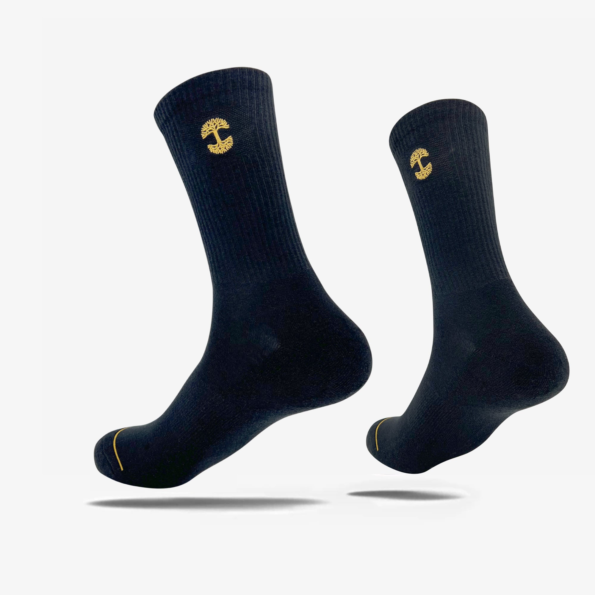 High-cut men's black crew socks with gold embroidered Oaklandish logo at the top.