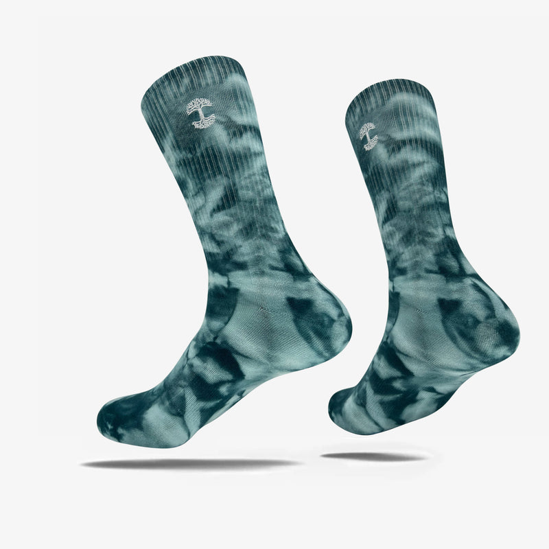 High-cut light and dark blue crew socks with an embroidered Oak logo detail near the top.