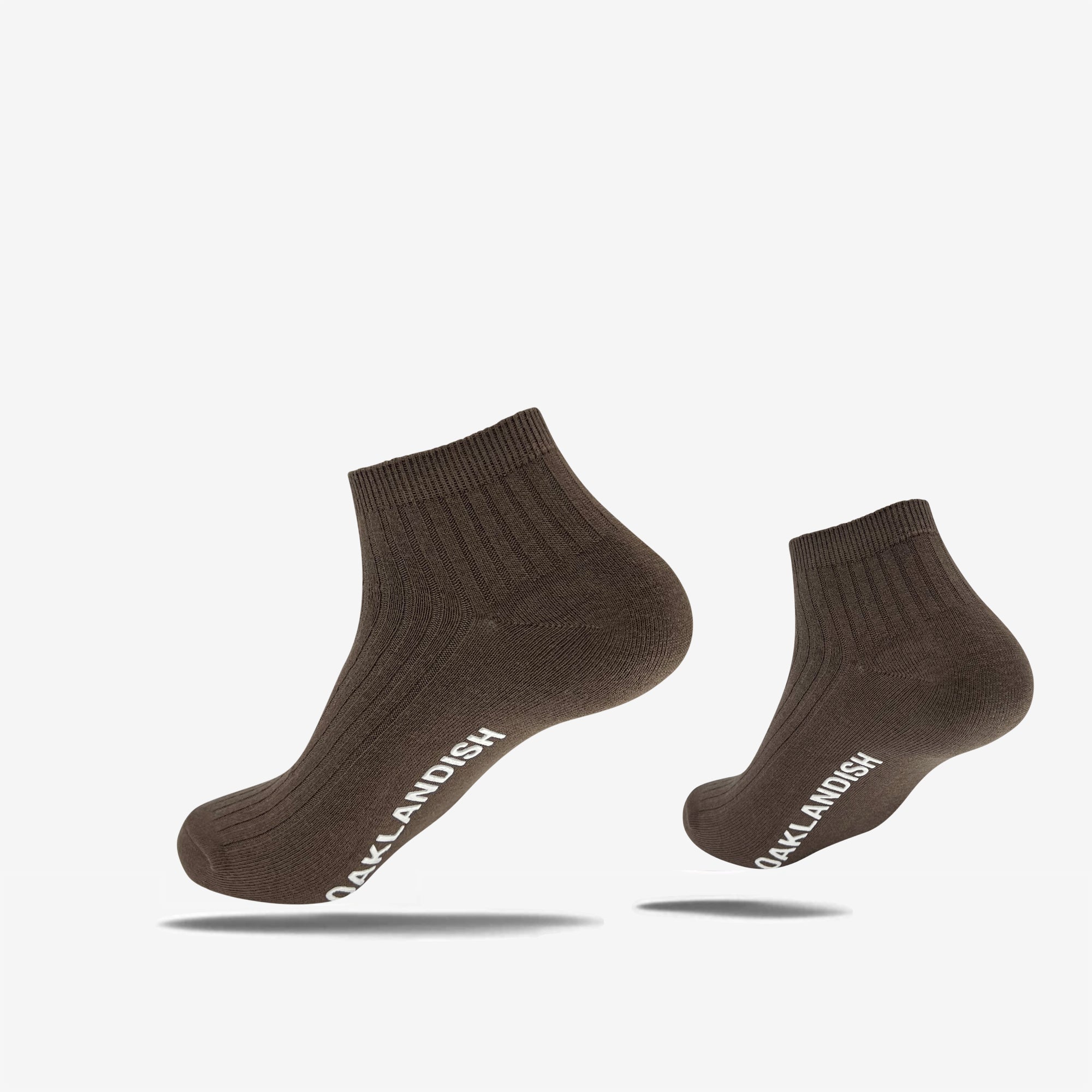Low-cut crew socks in slate brown with white Oaklandish wordmark on the sole.