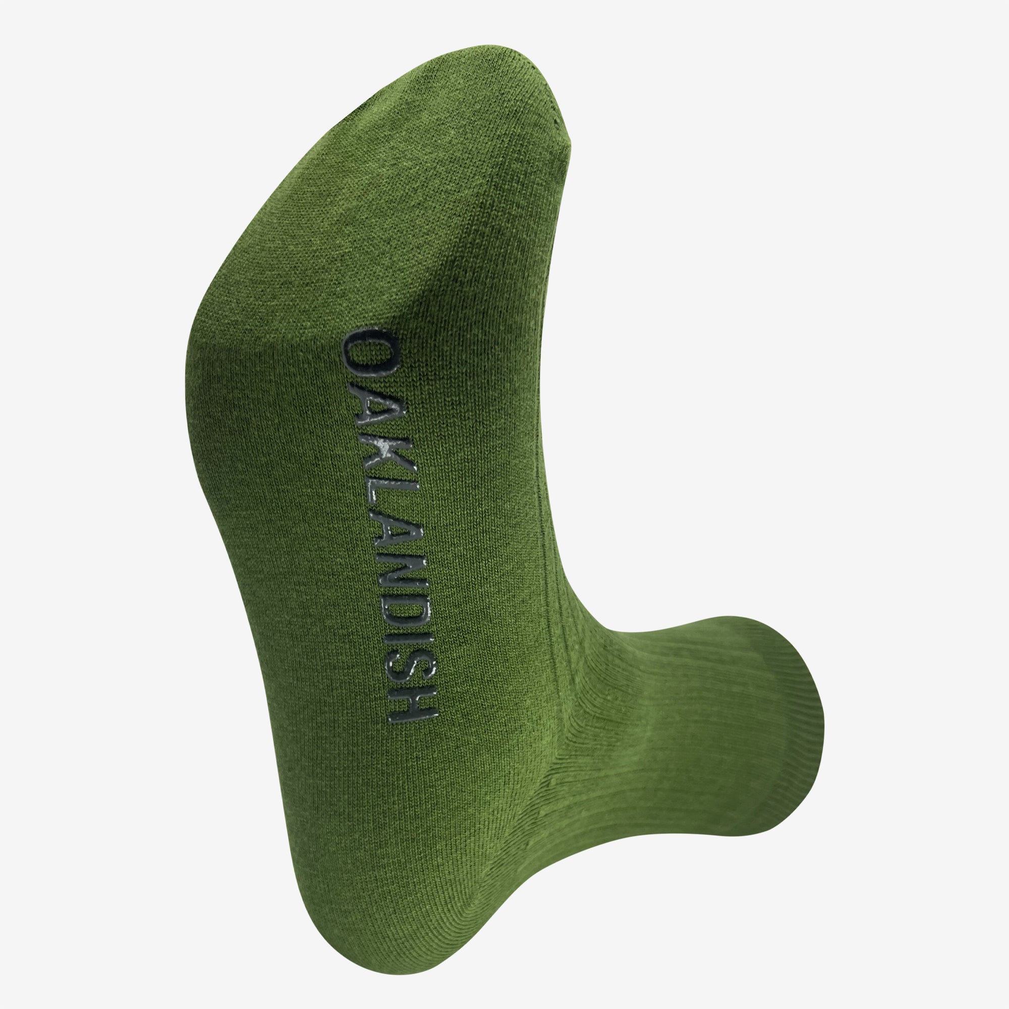 Single green men's crew socks. Bottom view with black Oaklandish wordmark on sole.