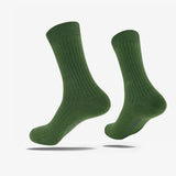 High-cut green crew socks with a black Oaklandish wordmark on the sole.