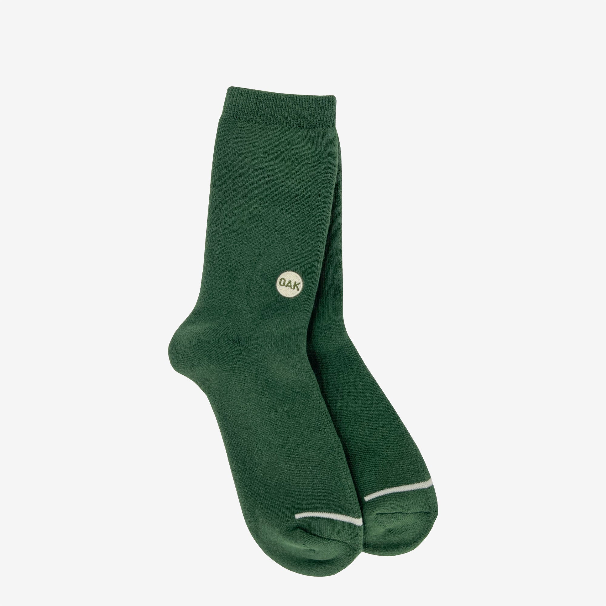 Plush high-cut green crew socks with an embroidered Oak wordmark detail on the ankle on white background.
