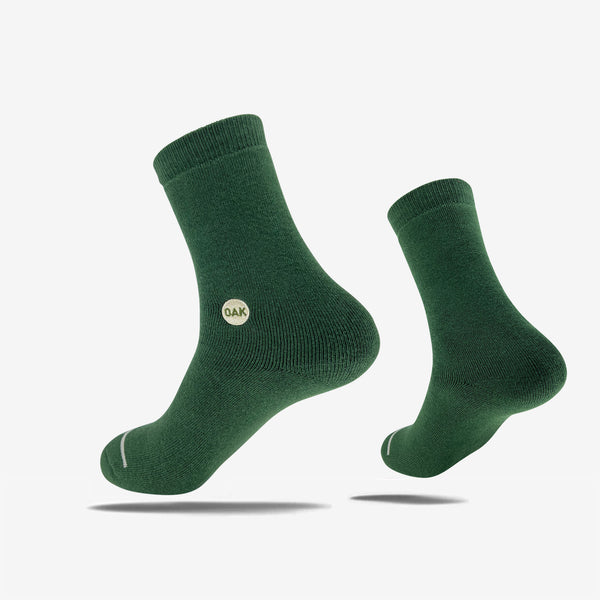 Plush high-cut green crew socks with an embroidered Oak wordmark detail on the ankle.